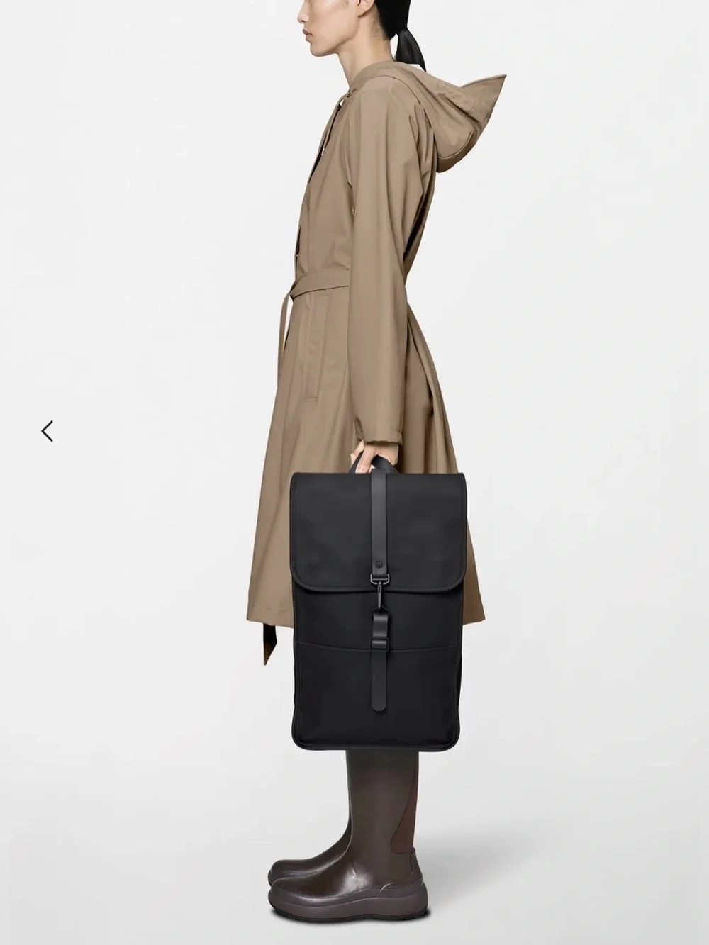 Rains  Backpack is clean and ever-contemporary. Like new no tag